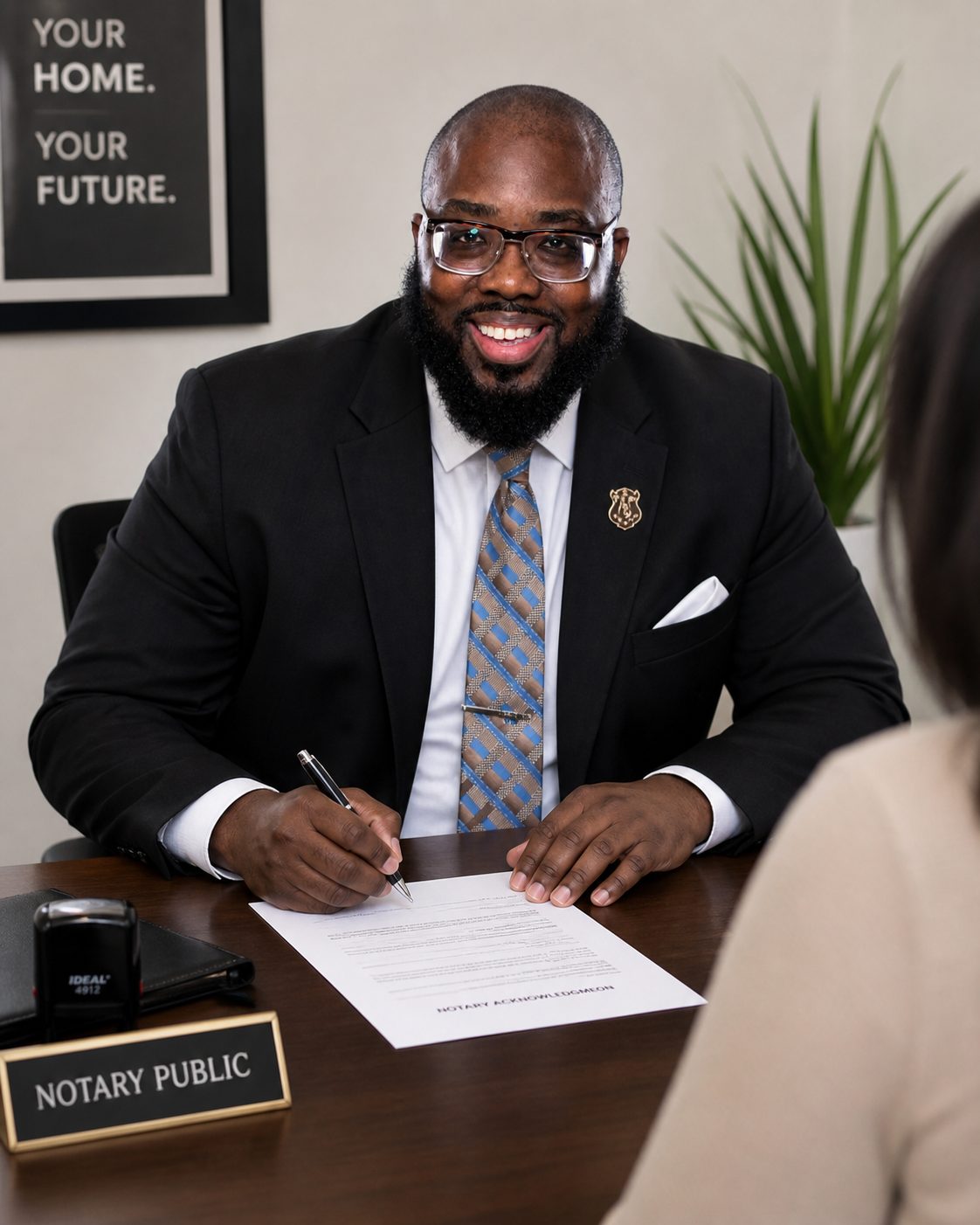 Chester at Notary Public desk with clients